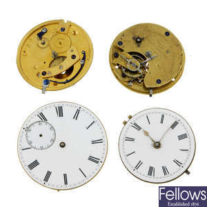 A large group of pocket watch movements and dials. Approximately 75.