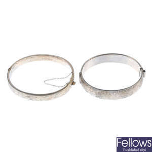 A selection of silver and white metal hinged bangles.