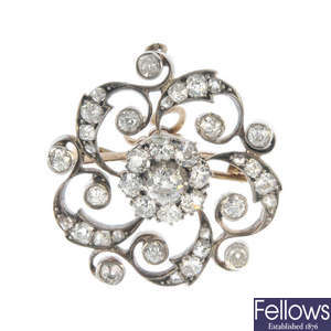 A late 19th century silver and 9ct gold diamond cluster brooch.