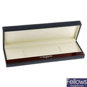 A group of six Longines watch boxes.