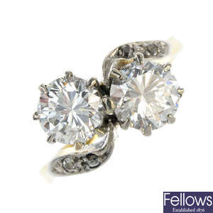 An 18ct gold diamond two-stone crossover ring.