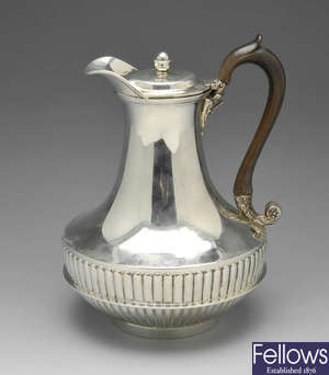 A George III silver hot water jug.