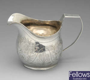 A George IV silver cream jug.