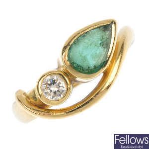 An 18ct gold emerald and diamond ring.