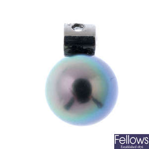 A platinum stained cultured pearl and diamond pendant.