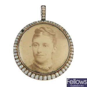 A mid 19th century 9ct gold split pearl double-sided photographic pendant.