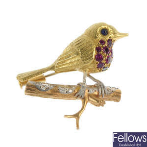 An 18ct gold diamond, ruby and sapphire robin brooch.