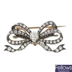 A late 19th century silver and 9ct gold diamond bow brooch.