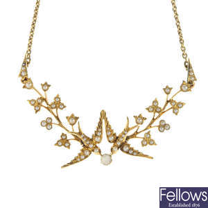 An early 20th century gold split pearl swallow necklace. 