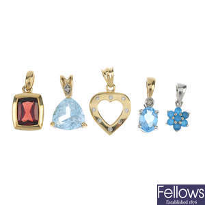 Six diamond and gem-set pendants.
