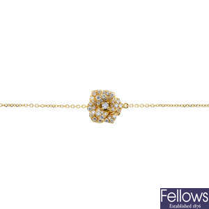 A diamond floral bracelet.