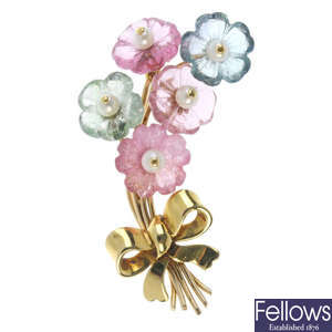 An 18ct gold gem-set floral brooch. 