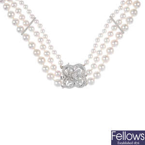 An 18ct gold cultured pearl three-row necklace, with diamond-set clasp.