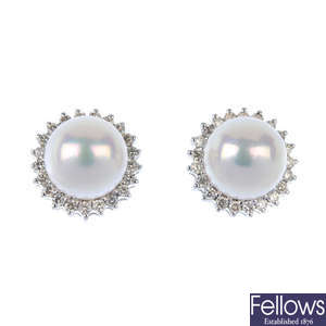 A pair of cultured pearl and diamond cluster earrings. 