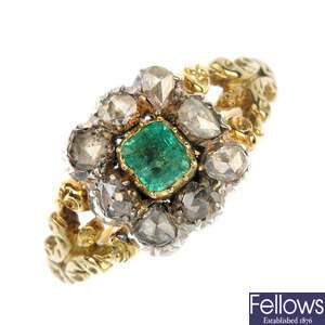 A mid 19th century silver and 15ct gold foil-back emerald and diamond cluster ring.