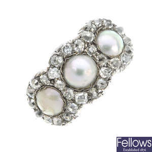 A late 19th century gold and silver split pearl and diamond triple cluster ring.