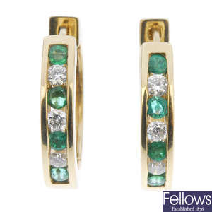 A pair of emerald and diamond ear hoops.