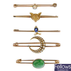 A selection of five mostly gem-set bar brooches.