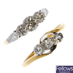 Two mid 20th century platinum and 18ct gold diamond three-stone rings.