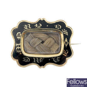 A late 19th century gold enamel mourning brooch.
