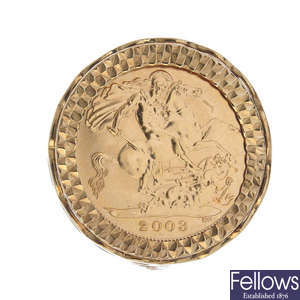 A 9ct gold mounted half sovereign coin ring.