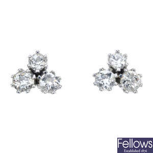 A pair of diamond three-stone ear studs. 