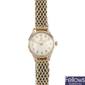 OMEGA - a lady's 9ct gold manual wind wristwatch.