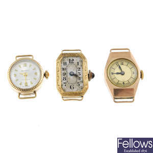 A small group of three lady's watch heads and a lady's bracelet watch.