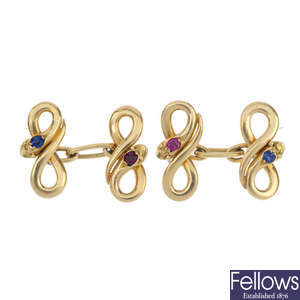 A pair of late 19th century 18ct gold sapphire and ruby snake cufflinks.