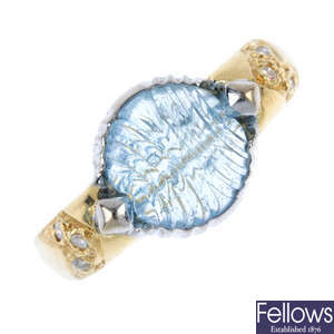 An 18ct gold aquamarine and diamond ring.