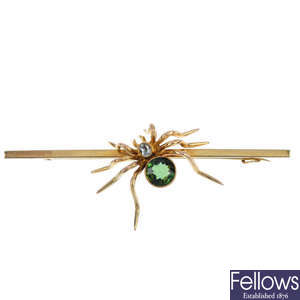 An early 20th century 9ct gold gem-set spider brooch. 