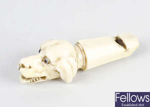 A Victorian ivory whistle.