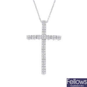 A diamond articulated cross pendant, on chain.