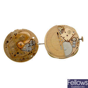 A small selection of four Omega watch movements.