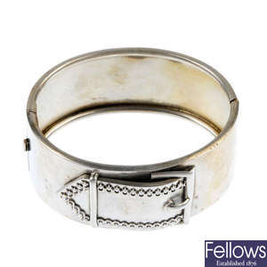 A late 19th century silver hinged bangle, with buckle motif.
