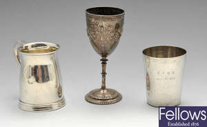 A small Victorian silver goblet & a 1930's beaker & small mug. (3).