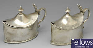 A pair of Edwardian silver mustard pots, a further mustard pot & a pepper pot. (4).