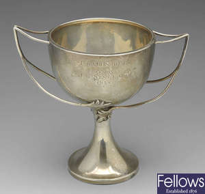 A 1930's trophy cup & a 1930's golfing mug. (2).