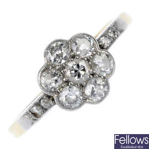 A mid 20th century platinum and 18ct gold diamond cluster ring.