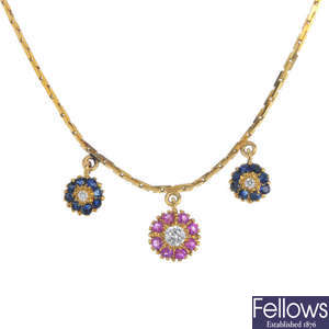A diamond and gem-set floral necklace.