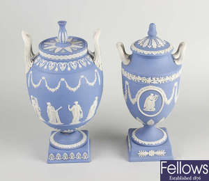 A Wedgwood blue jasperware pedestal, twin handled vase and cover.
