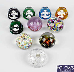 A set of four Franklin Mint Baccarat commemorative glass paperweights. 