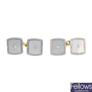 A pair of early 20th century 18ct gold and platinum mother of pearl cufflinks.