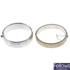 A selection of four silver bangles.