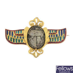 An early 20th century gold Egyptian revival winged scarab brooch. 