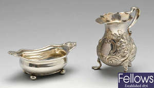 A George II silver cream jug, plus a George III open silver salt. 