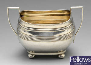 A George V silver sugar bowl, plus a 1930's sauce boat and caster.