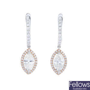 A pair of diamond ear pendants.