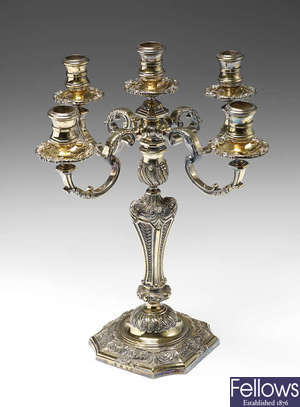 A modern silver-gilt candelabrum in the manner of Paul de Lamerie.