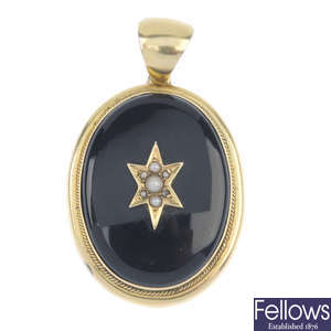 A late Victorian seed pearl and onyx memorial pendant.